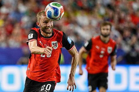 Austria's Konrad Laimer (20) heads the ball during the World Cup Group J soccer match between Algeria and Austria in Kansas City, Mo., Saturday, June 27, 2026.