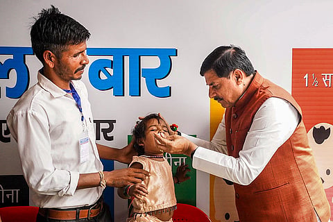 In this image posted on June 28, 2026, A child receives polio drops from Madhya Pradesh Chief Minister Mohan Yadav under the National Pulse Polio campaign, in Betul, Madhya Pradesh.