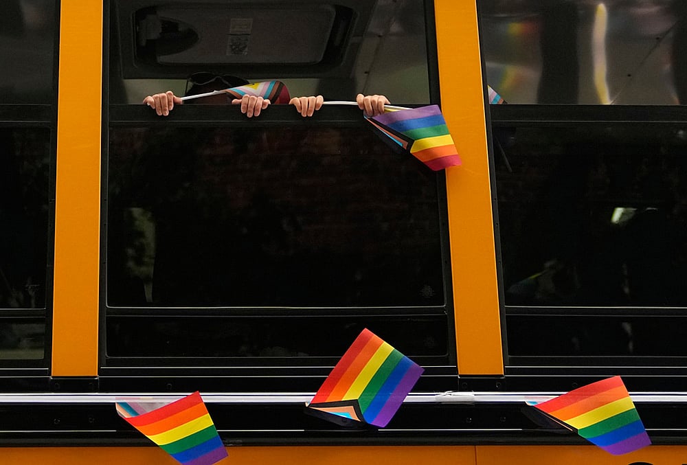  Seattle Pride Parade Children hold pride flags