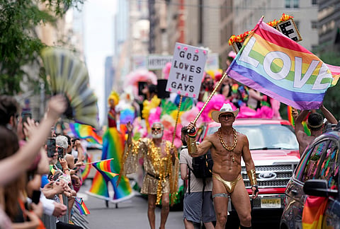 Parade-goers walk in the 57th annual NYC Pride March in New York. 