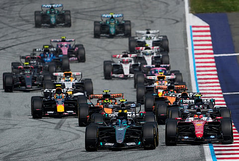 Mercedes driver George Russell of Britain leads at the start and followed by Ferrari driver Charles Leclerc of Monaco during the Austrian F1 Grand Prix, in Spielberg, Austria, Sunday, June 28, 2026. 