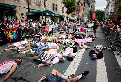Participants from Gays Against Guns lie down on the parade route during the 57th annual NYC Pride March on Sunday, June 28, 2026, in New York. 