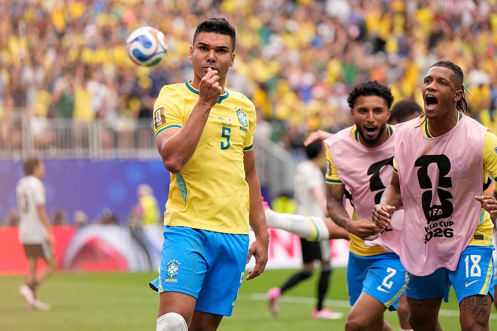 Brazils Casemiro celebrates after scoring his sides first goal during the World Cup round of 32 soccer match between Brazil and Japan in Houston