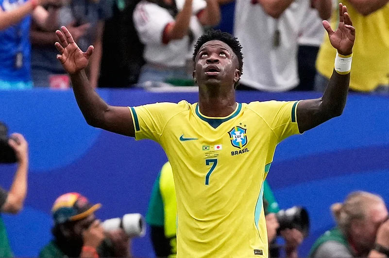 Brazils Vinicius Junior (7) celebrates his sides opening goal during the World Cup round of 32 soccer match between Brazil and Japan in Houston