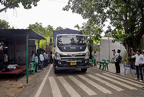 A vehicle carrying household goods leaves the official residence of former Bihar chief minister Rabri Devi as she begins vacating the government bungalow after the eviction notice deadline expired, in Patna.