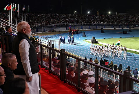 Prime Minister Narendra Modi looks on at the contingents from the Indian Navy and the Assam Rifles during the Seychelles National Day celebrations. 