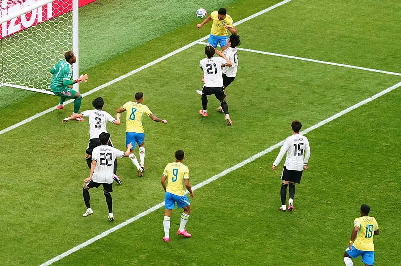 Brazils Casemiro (5) scores his sides first goal during the World Cup round of 32 soccer match between Brazil and Japan in Houston