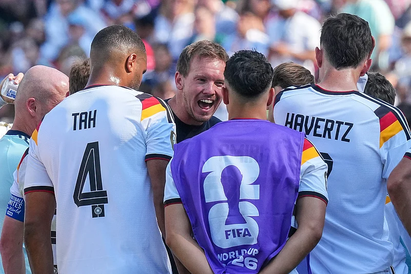 Germany head coach Julian Nagelsmann talks with his players at the hydration break during the World Cup round of 32 soccer match between Germany and Paraguay in Foxborough