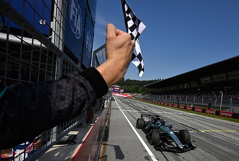 Mercedes driver George Russell of Britain crosses the finish line to win the Austrian F1 Grand Prix, in Spielberg, Austria, Sunday, June 28, 2026. 