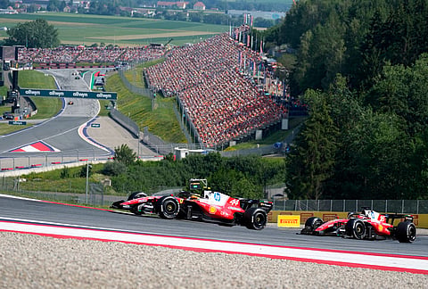 Ferrari driver Lewis Hamilton of Britain steers his car followed by Ferrari driver Charles Leclerc of Monaco during the Austrian F1 Grand Prix, in Spielberg, Austria, Sunday, June 28, 2026. 
