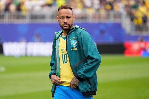 Brazil's Neymar (10) arrives on the pitch before the World Cup round of 32 soccer match between Brazil and Japan in Houston