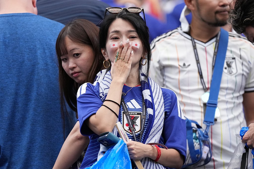 Japanese fan cries after the World Cup round of 32 soccer match between Brazil and Japan in Housto