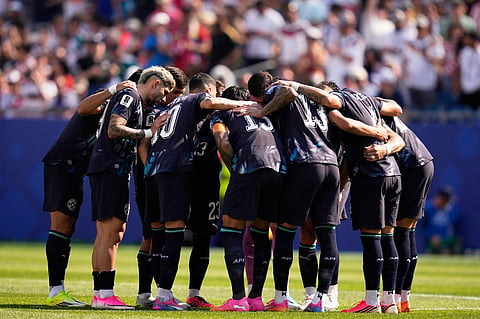 Paraguay players gather together on the pitch before the World Cup round of 32 soccer match between Germany and Paraguay in Foxborough
