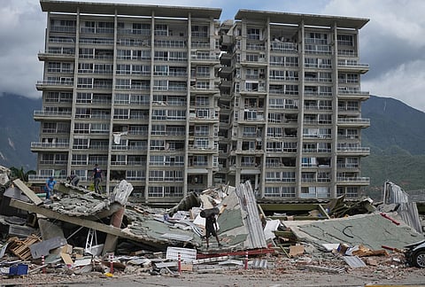An earthquake-damaged building stands in La Guaira, Venezuela.