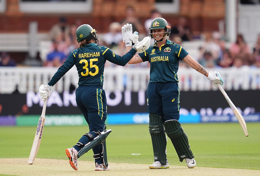 Australia's Georgia Wareham and Ashleigh Gardner celebrate the winning runs as they beat India during the Women's T20 World Cup cricket match between Bangladesh and South Africa at Lord's Cricket Ground, in London, Sunday June 28, 2026.  - | Photo: Adam Davy/PA via AP