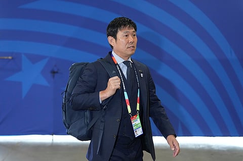 Japan head coach Hajime Moriyasu arrives at the stadium ahead the World Cup round of 32 soccer match between Brazil and Japan in Houston