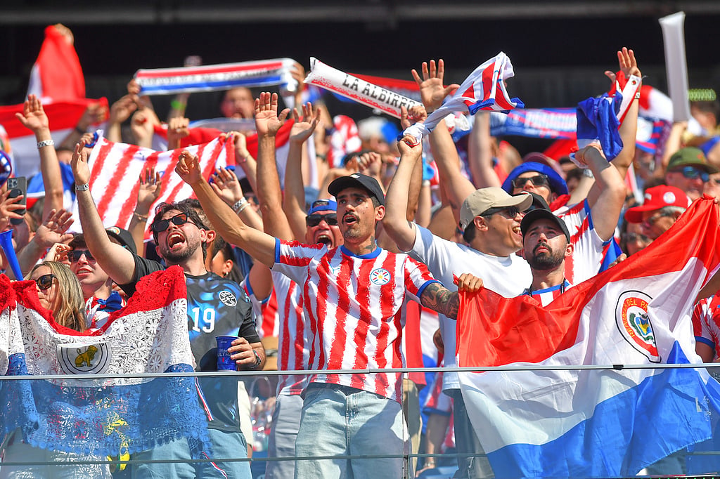 Paraguay fans cheer during the World Cup round of 32 soccer match against Germany in Foxborough