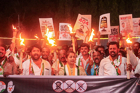 Congress MP Praniti Shinde leads a torchlight march against the government over the paper leak issue, in Solapur, Maharashtra.