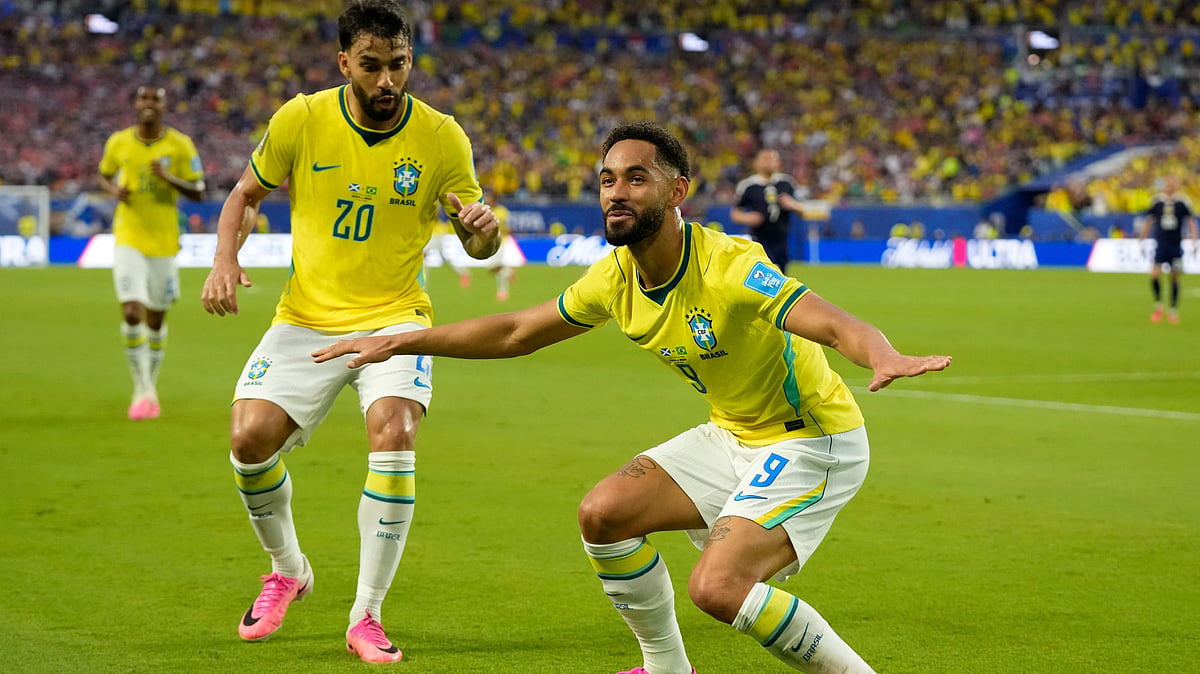 Brazil's Matheus Cunha (9) celebrates with Lucas Paqueta (20) after scoring their third goal during the World Cup Group C soccer match between Scotland and Brazil in Miami Gardens. - (AP Photo/Lynne Sladky)
