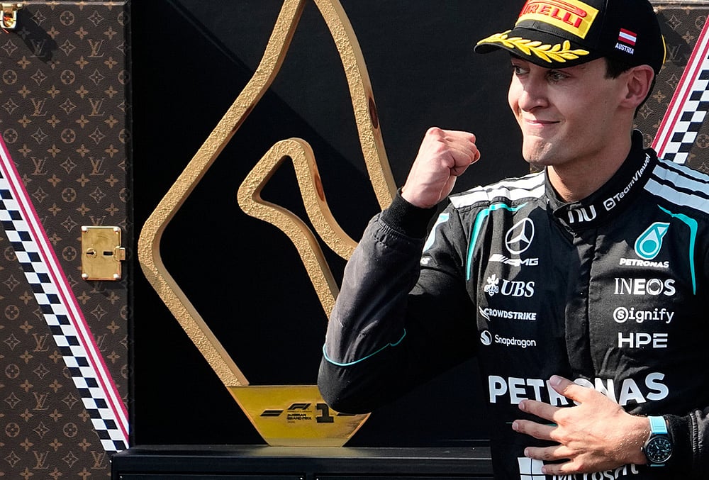 Mercedes driver George Russell of Britain celebrates on the podium after winning the Austrian F1 Grand Prix, in Spielberg, Austria, Sunday, June 28, 2026.  - | Photo: AP/Darko Bandic