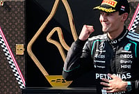 | Photo: AP/Darko Bandic : Mercedes driver George Russell of Britain celebrates on the podium after winning the Austrian F1 Grand Prix, in Spielberg, Austria, Sunday, June 28, 2026. 