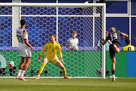 Paraguay's Julio Enciso, right, scores the opening goal past Germany goalkeeper Manuel Neuer during the World Cup round of 32 soccer match between Germany and Paraguay in Foxborough