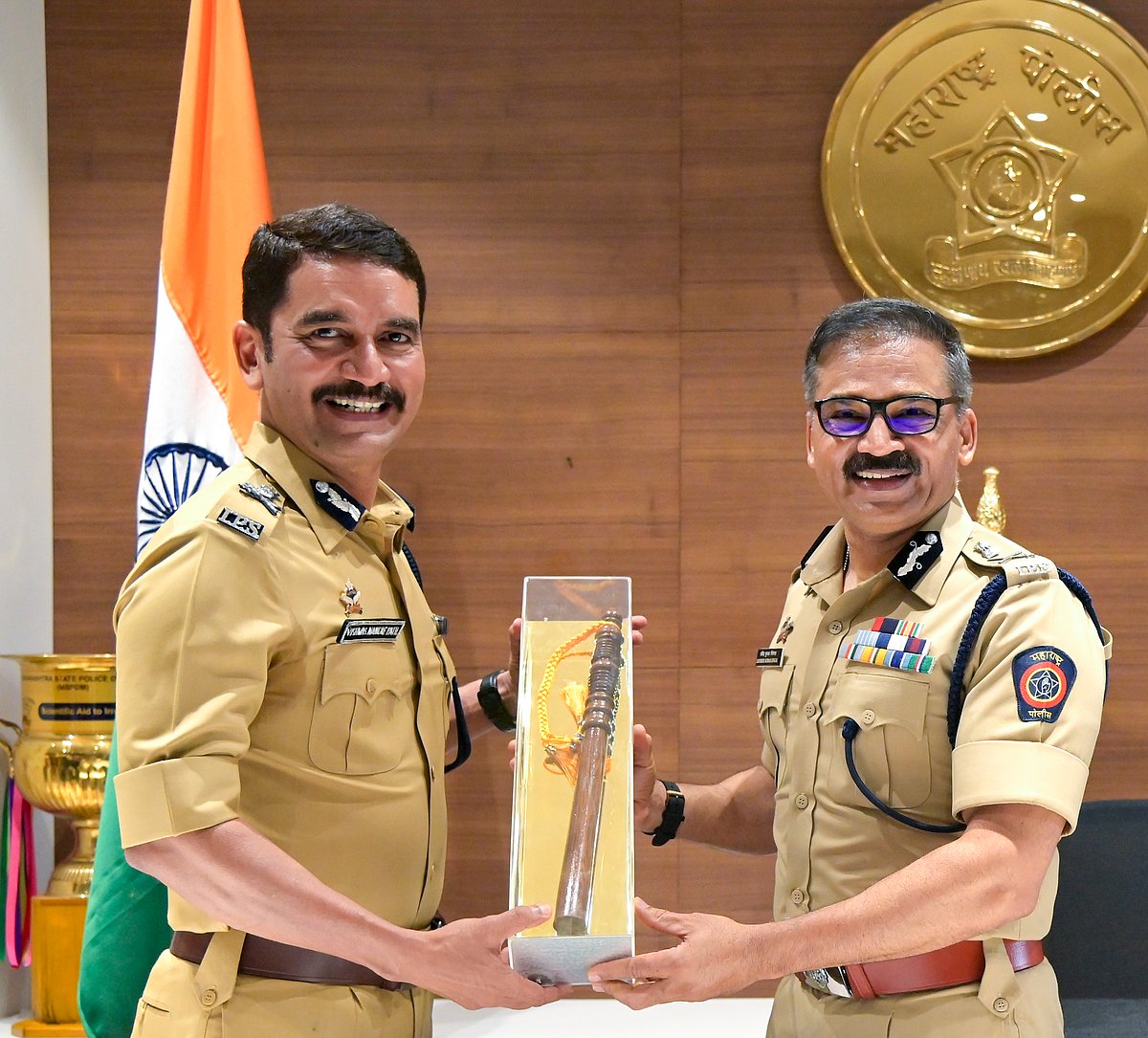 SUNNY SHENDE : (Vishwas Nangre Patil at left)
The 45-second video, which has been widely circulated on social media, shows the 1997-batch IPS officer addressing the event organised to mark the RSS's centenary year.