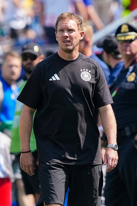 Germany head coach Julian Nagelsmann arrives for interviews in the pitch before the World Cup round of 32 soccer match between Germany and Paraguay in Foxborough