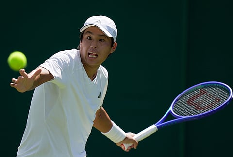 Learner Tien of the United States returns the ball to Dalibor Svrcina of Czech Republic in their first round men's singles match at the Wimbledon Tennis Championships in London, Monday, June 29, 2026. 