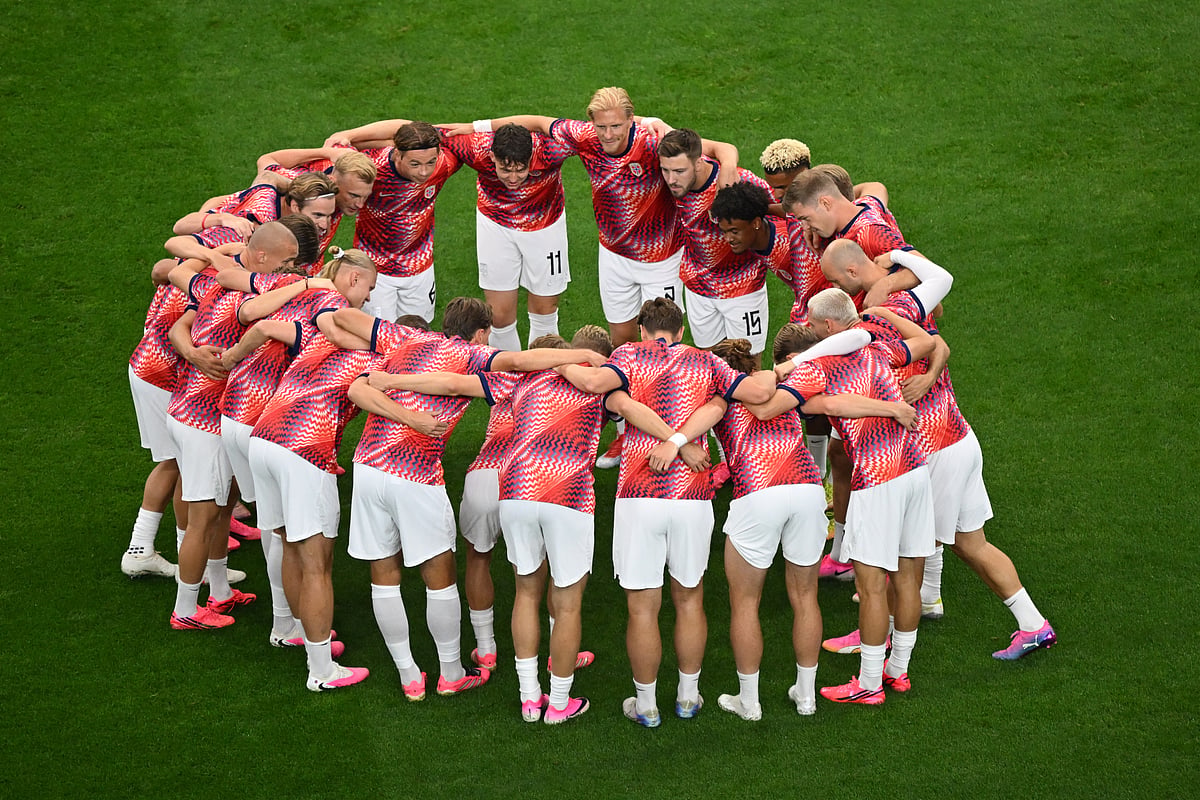 Norwegian players huddle during a warm up before the World Cup round of 32 soccer match between Ivory Coast and Norway - AP/Jessica Tobias