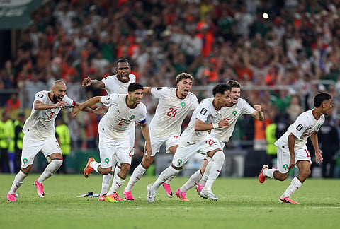 The Moroccan team starts to celebrate after winning on penalty kicks the World Cup round of 32 soccer match between the Netherlands and Morocco in Guadalupe, near Monterrey, Mexico.