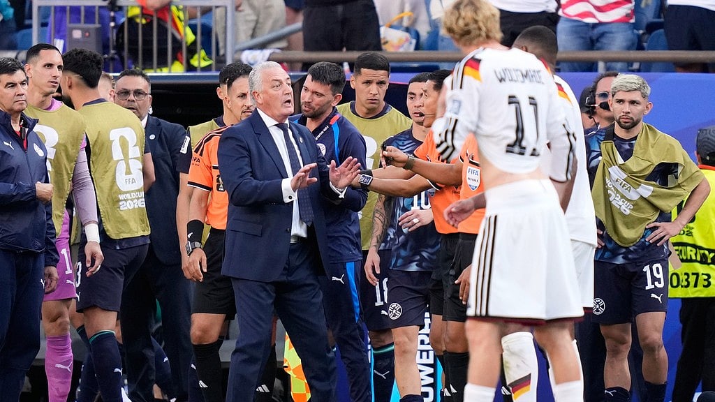 Paraguay head coach Gustavo Alfaro gestures during the World Cup round of 32 soccer match between Germany and Paraguay in Foxborough, Mass., near Boston, Monday, June 29, 2026. - AP Photo/Charles Krupa