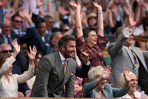 Soccer legend David Beckham and his mother Sandra Georgina Beckham react during the men's singles match between Jannik Sinner of Italy and Miomir Kecmanovic of Serbia at the Wimbledon Tennis Championships in London, Monday, June 29, 2026.