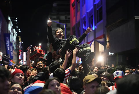 People watch the World Cup round of 32 soccer match between Paraguay and Germany in Asuncion, Paraguay.