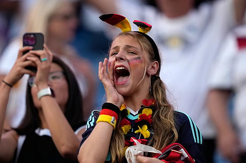 A Germany fan reacts at the end of the World Cup round of 32 soccer match between Germany and Paraguay in Foxborough