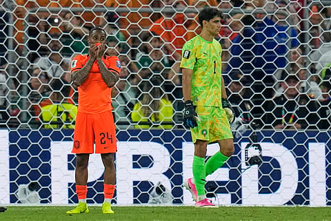 Netherlands' Crysencio Summerville (24) reacts after missing a penalty as Morocco goalkeeper Yassine Bounou (1) walks past during the World Cup round of 32 soccer match between the Netherlands and Morocco in Guadalupe, near Monterrey, Mexico, Monday, June 29, 2026.

