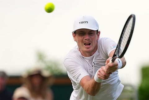Jack Pinnington Jones of Britain returns the ball to Brandon Nakashima of the United States during the men's singles at the Wimbledon Tennis Championships in London, Monday, June 29, 2026.