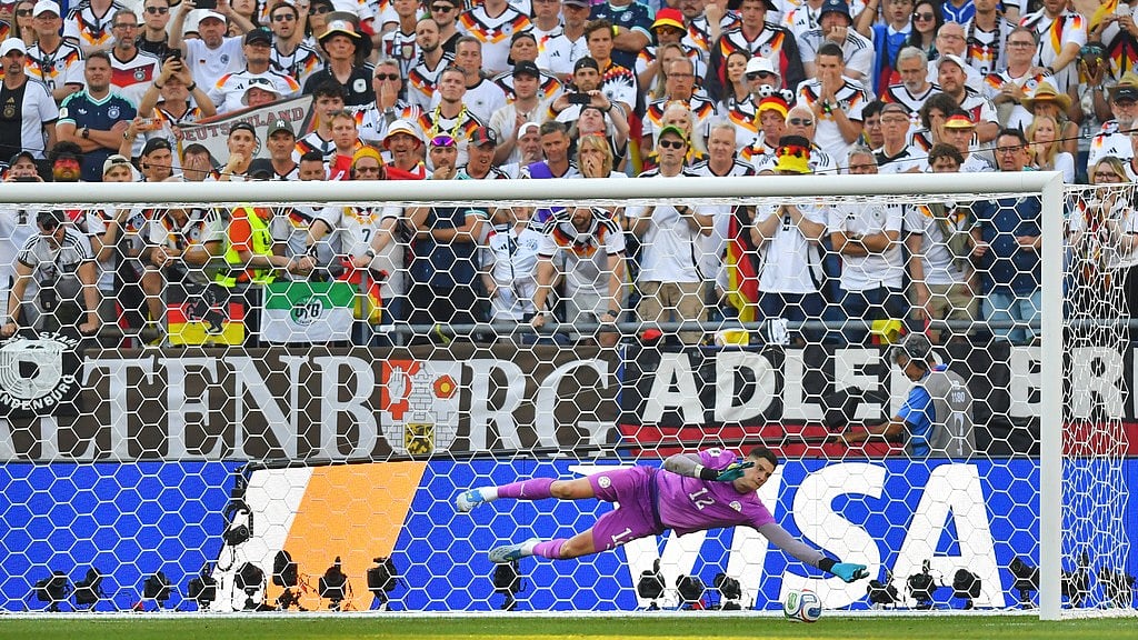 Paraguay goalkeeper Orlando Gill (12) saves a shot by Germany's Nick Woltemade (11) in a shootout during the World Cup round of 32 soccer match in Foxborough, Mass., near Boston, Monday, June 29, 2026. - AP Photo/Steven Senne