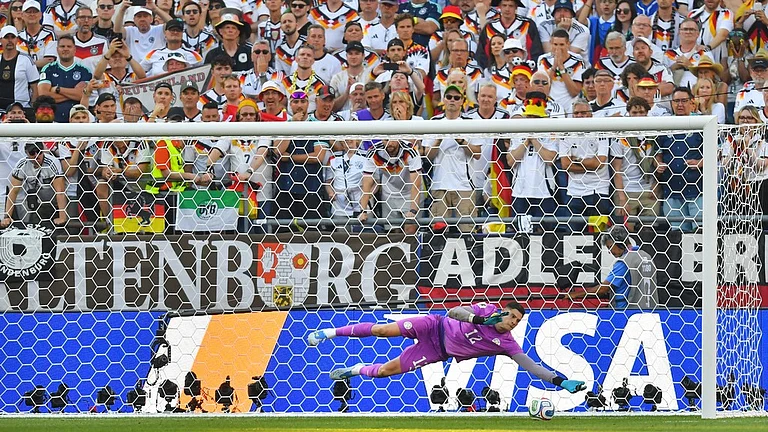 Paraguay goalkeeper Orlando Gill (12) saves a shot by Germany's Nick Woltemade (11) in a shootout during the World Cup round of 32 soccer match in Foxborough, Mass., near Boston, Monday, June 29, 2026. - AP Photo/Steven Senne