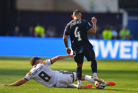 Germany's Leon Goretzka (8) slides against Paraguay's Juan Jose Caceres (4) during the World Cup round of 32 soccer match between Germany and Paraguay in Foxborough, Mass., near Boston.
