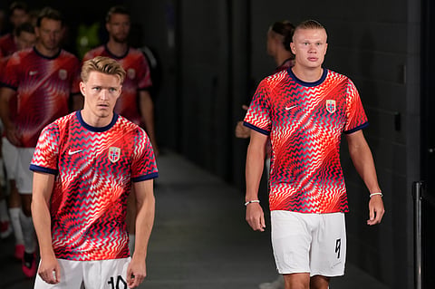 Norway's Erling Haaland (9) enters with teammates the pitch before the World Cup round of 32 soccer match