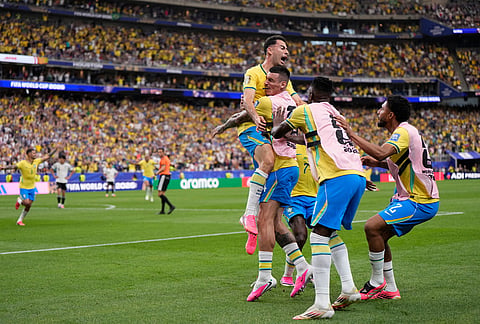 Brazil's Gabriel Martinelli (22) celebrates after scoring his side's second goal during the World Cup round of 32 soccer match between Brazil and Japan in Houston.