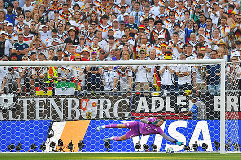 Paraguay goalkeeper Orlando Gill (12) saves a shot by Germany's Nick Woltemade (11) in a shootout during the World Cup round of 32 soccer match in Foxborough