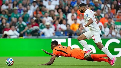 (AP Photo/Dolores Ochoa) : Netherlands Denzel Dumfries (22) is tripped by Moroccos Ismael Saibari (11) during the World Cup round of 32 soccer match between the Netherlands and Morocco in Guadalupe, near Monterrey, Mexico, Monday, June 29, 2026.