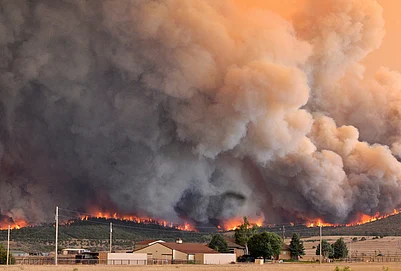 | Photo: Jerilee Bennett/The Gazette via AP : The Aspen Acres fire engulfs a hillside near Beulah, Colorado.