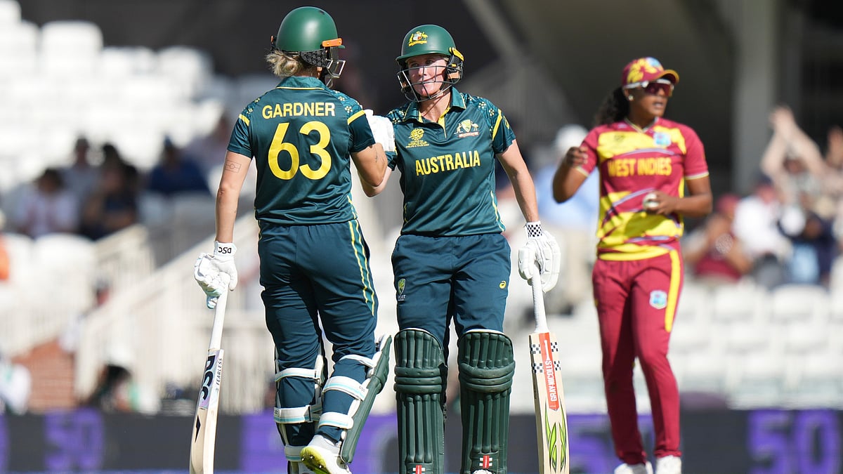 Australia's Beth Mooney, right, celebrates her fifty runs with Ashleigh Gardner during the Women's T20 Cricket World Cup semifinal between Australia and West Indies in London, Tuesday, June 30, 2026 - (AP Photo/Alastair Grant)
