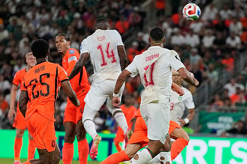 Morocco's Issa Diop (14) scores his team's first goal during the World Cup round of 32 soccer match between the Netherlands and Morocco in Guadalupe, near Monterrey, Mexico, Monday, June 29, 2026. 