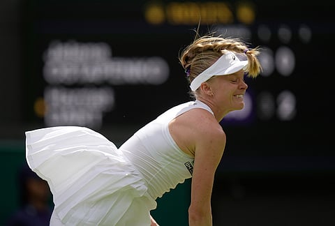 Harriet Dart of Britain reacts while serving against Jelena Ostapenko of Latvia in their first round women's singles match at the Wimbledon Tennis Championships in London, Monday, June 29, 2026. 