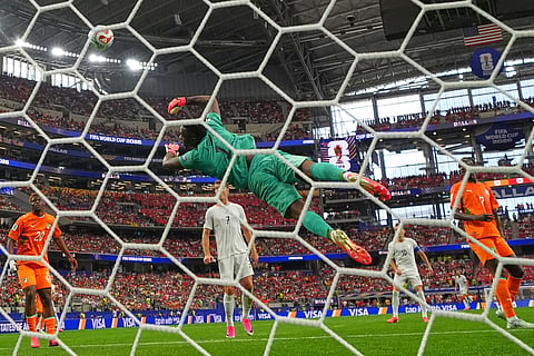 Norway's Antonio Nusa (20) scores their opening goal past Senegal goalkeeper Yehvann Diouf (1) 