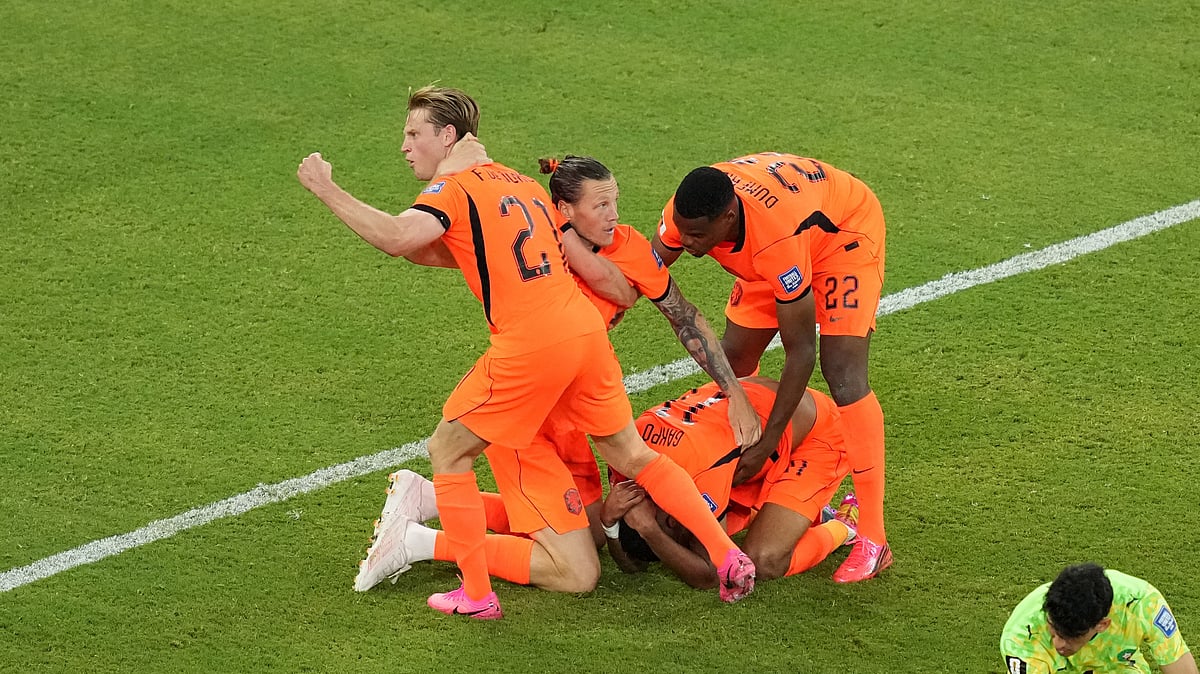Netherlands' Cody Gakpo (11) celebrates with teammates after scoring their first goal during the World Cup round of 32 soccer match between the Netherlands and Morocco in Guadalupe, near Monterrey, Mexico, Monday, June 29, 2026. - (AP Photo/Moises Castillo)